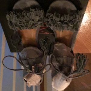 Powder blue wedge fringe sandals.